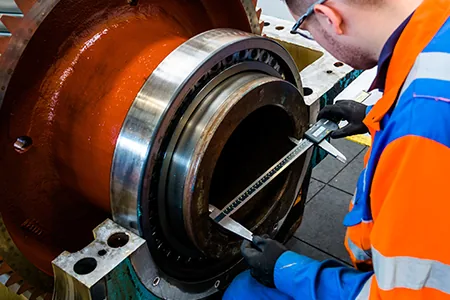 Engineer working on an industrial gearbox
